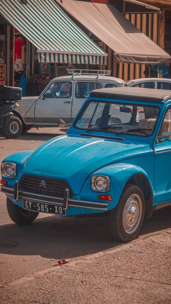 Retro Citroen Dyane 6 from 1972 parked on a bustling street, showcasing vintage charm.